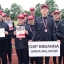 Druzyna MDP Bibianna w granatowych dresach i czerwonych czapkach